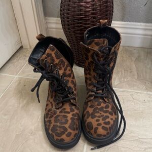 Cheetah print combat boots.
